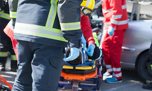 medics loading patient into ambulance