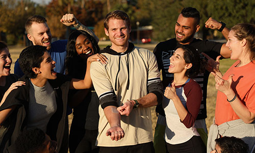 group of people smiling at camera