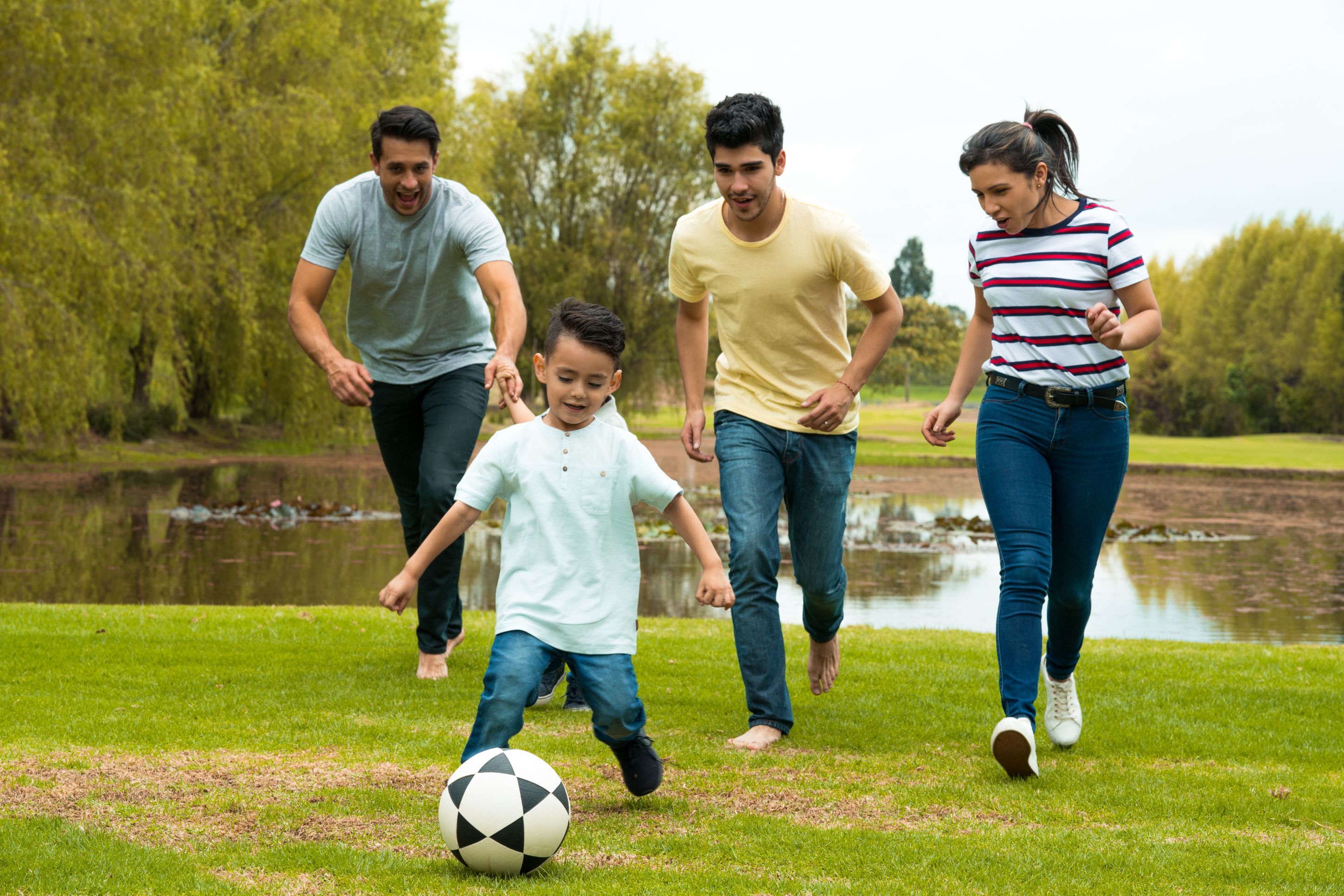 family playing soccer
