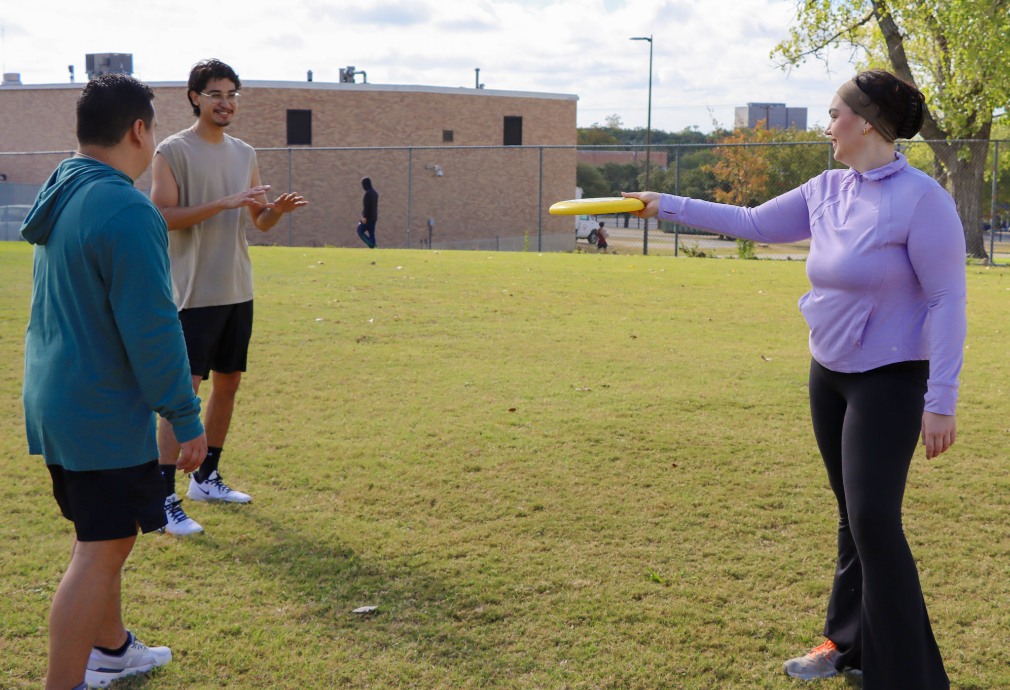 friends playing frisbee