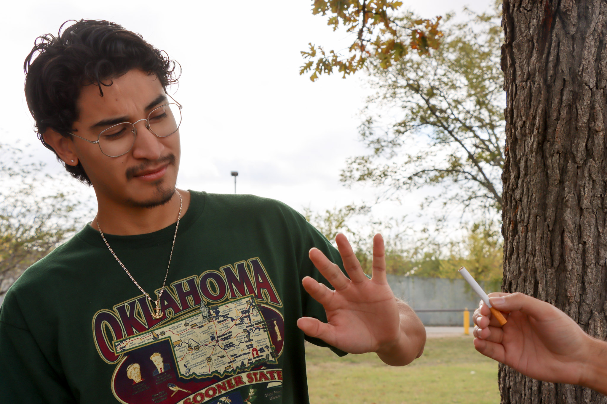 man refusing cigarette